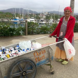 Dona Mari collects the recycling out of the trash bins every morning and afternoon and walks it on the cobblestone streets who knows how far. She's a hero.